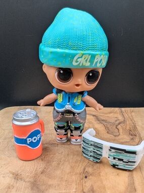 L.O.L. Surprise! Doll GLITCH With Teal Beanie, Blue Top, Orange Can